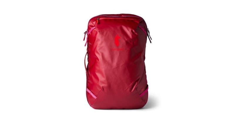 The Cotopaxi Allpa 35L Travel Pack in crimson red, a boxy carry-on sized travel backpack