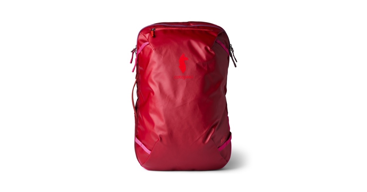 The Cotopaxi Allpa 35L Travel Pack in crimson red, a boxy carry-on sized travel backpack