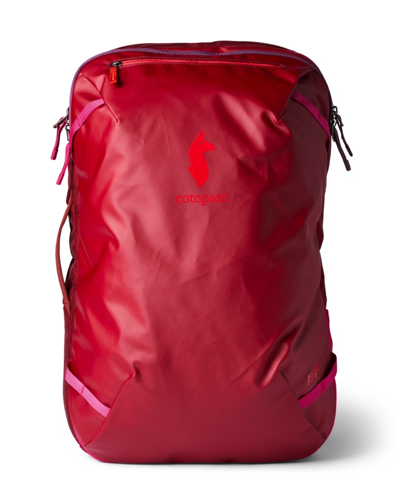 The Cotopaxi Allpa 35L Travel Pack shown from the front in crimson, with its boxy structured shape and side compression straps
