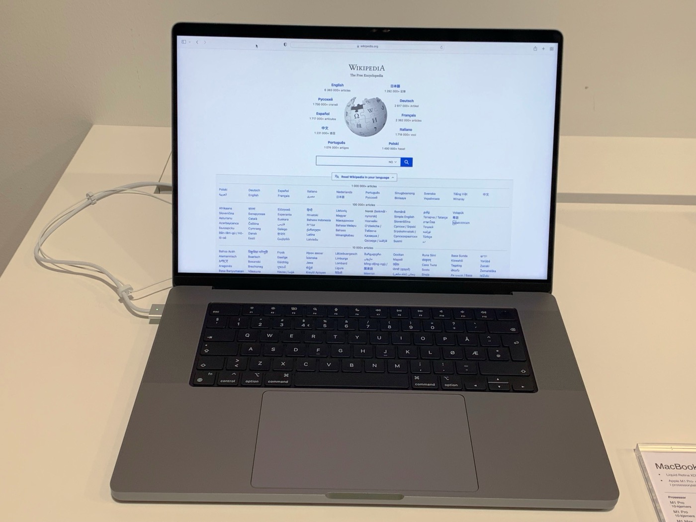 An Apple MacBook Pro laptop with the M1 chip, open on a desk