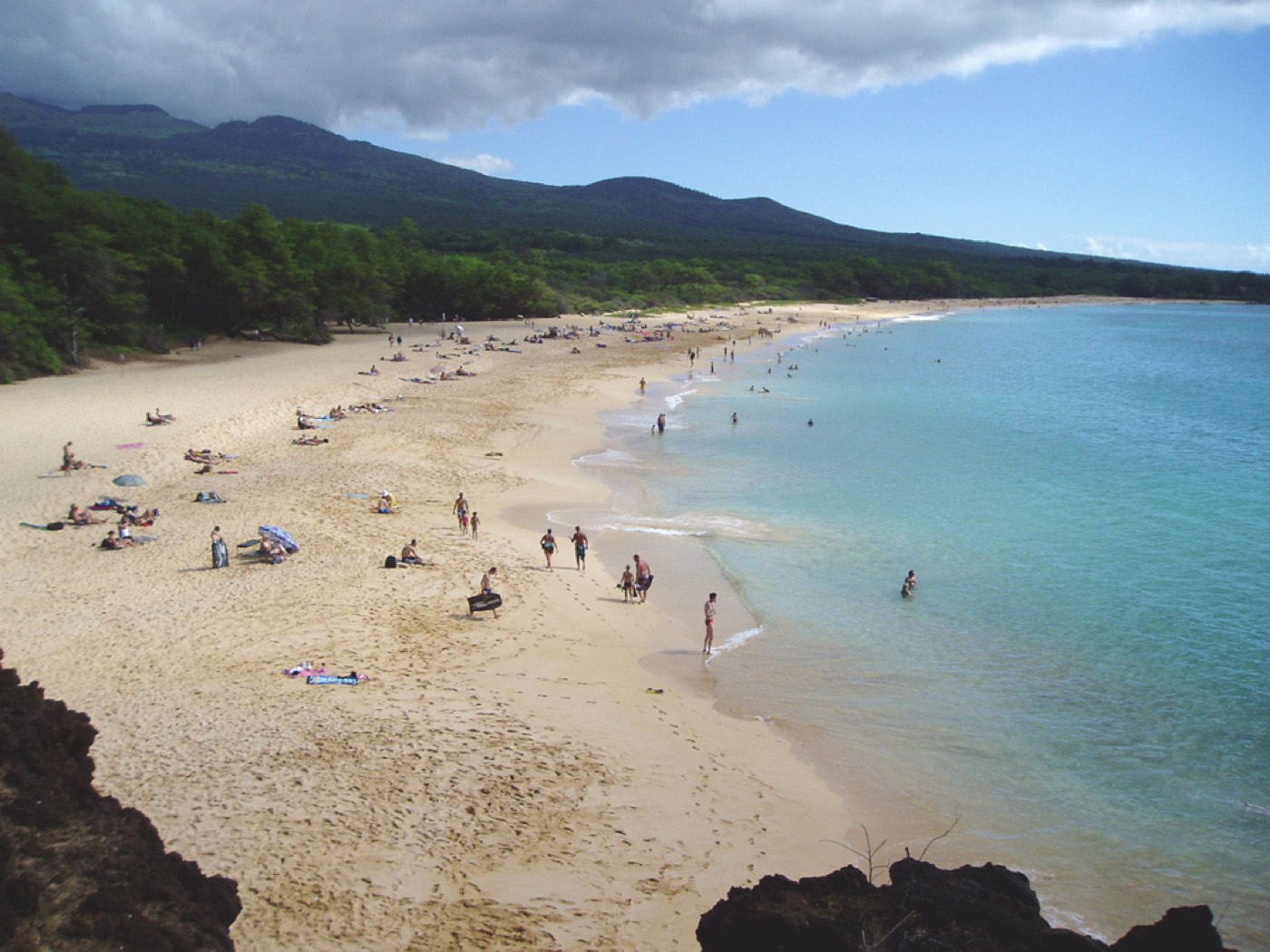The wide golden sand and turquoise water of Big Beach (Oneloa) in Makena, Maui