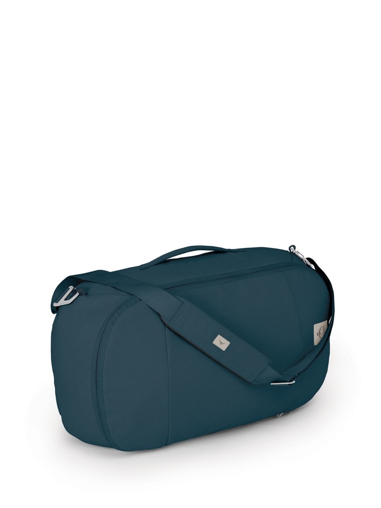 The Osprey Arcane Duffel Pack shown in full, a rounded 30 litre duffel in Stargazer Blue with a padded shoulder strap