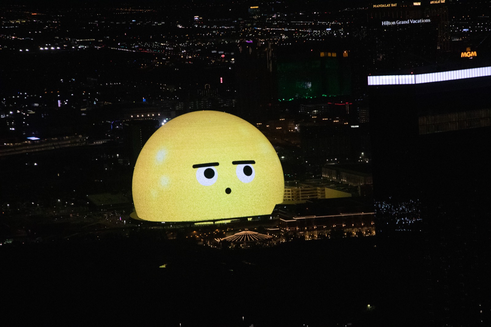 The Sphere in Las Vegas lit up at night on the Strip skyline